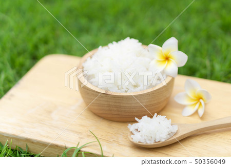 Close up white rice in wooden bowl with green Close up white rice in wooden bowl with green 50356049