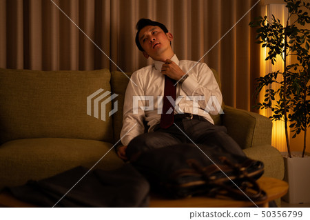 A man in a suit that came home A man in a suit that came home 50356799