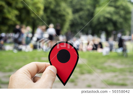 man with a red marker at Monbijou Park in Berlin 50358042