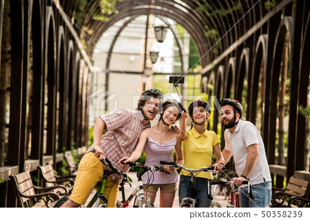 Happy students having fun outdoors. 50358239
