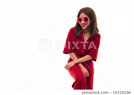 portrait of dark-skinned charming young girl gesticulating her hands portrait of dark-skinned charming young girl gesticulating her hands 50358296