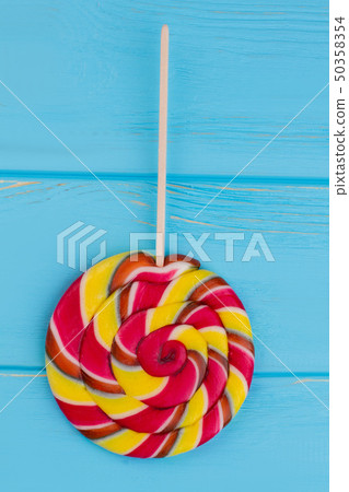 Colorful spiral lollipop candy on stick. 50358354