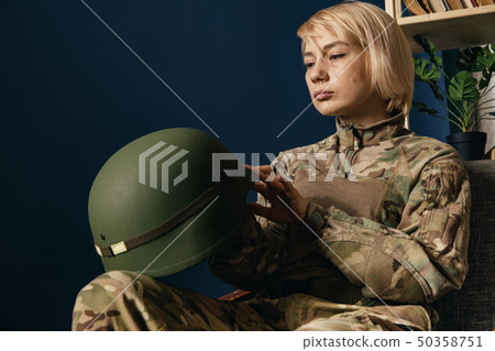 Portrait of young female soldier 50358751