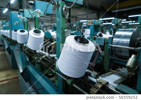 old knitted fabric. Textile factory in spinning production line and a rotating machinery and 50359252