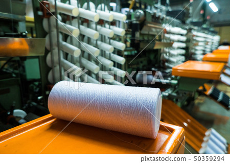 old knitted fabric. Textile factory in spinning production line and a rotating machinery and 50359294