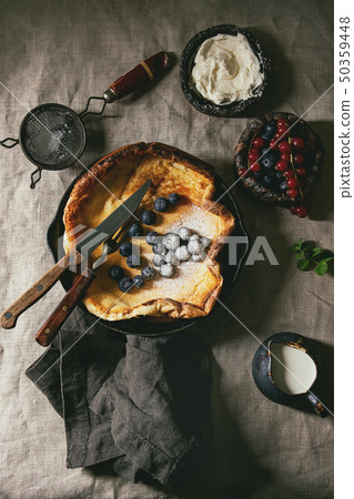 Dutch baby with berries Dutch baby with berries 50359448