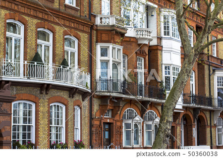 Luxury brick house with white windows in quiet area in central London. Apartments on the banks of Luxury brick house with white windows in quiet area in central London. Apartments on the banks of 50360038
