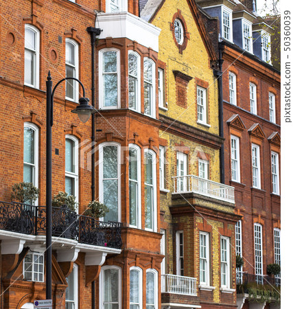 Luxury brick house with white windows in quiet area in central London. Apartments on the banks of Luxury brick house with white windows in quiet area in central London. Apartments on the banks of 50360039