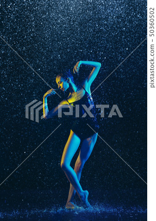 Two young female ballet dancers under water drops 50360502