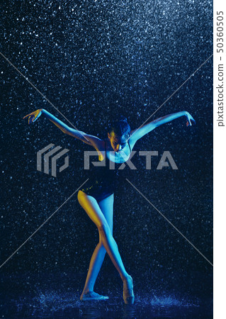 Two young female ballet dancers under water drops Two young female ballet dancers under water drops 50360505