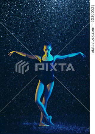Two young female ballet dancers under water drops Two young female ballet dancers under water drops 50360522