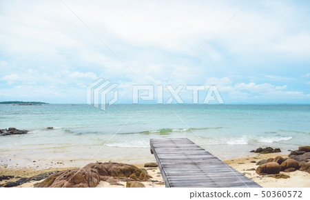 Wooden bridge on the beach and rocks,cloudy BG 50360572
