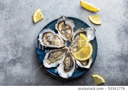 Fresh opened oysters Fresh opened oysters 50361776