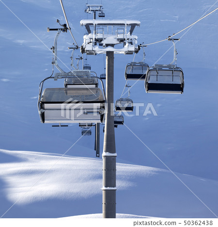 Chair-lift at early morning after snowfall 50362438