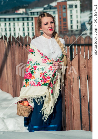 Woman with apples in the snow. Russian style Woman with apples in the snow. Russian style 50365411