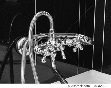 Tap closeup in modern bathroom Tap closeup in modern bathroom 50365622
