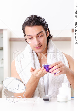 Young handsome man in the bathroom Young handsome man in the bathroom 50367320