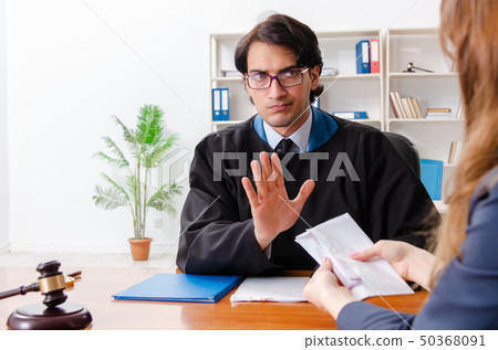 Young woman visiting male lawyer  50368091