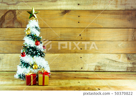 Christmas tree with many presents under it  50370822