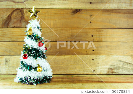 Christmas tree with many presents under it  50370824