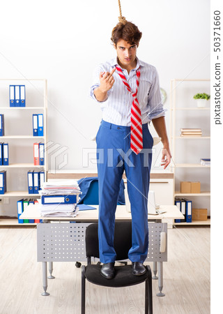 Desperate businessman thinking of committing suicide hanging 50371660