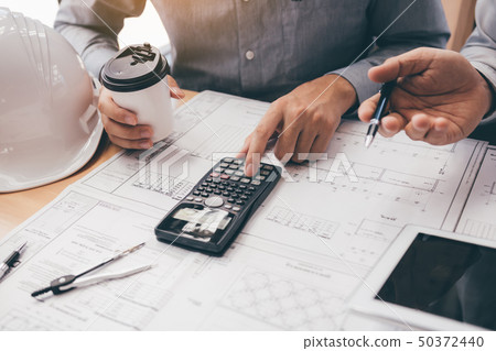 Two engineering working together and using digital Two engineering working together and using digital 50372440