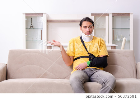 Young man after car accident suffering at home  50372591
