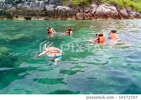 Tourist enjoying snorkeling mask dive underwater 50372597