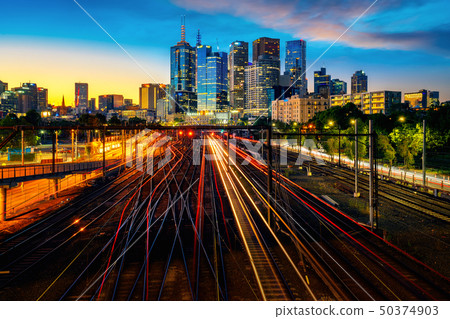 Melbourne train staation with Melbourne city backg 50374903