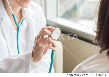 Doctor examining woman patient health in clinic Doctor examining woman patient health in clinic 50376751