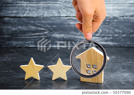 Two wooden stars and a house. Two star hotel  50377090