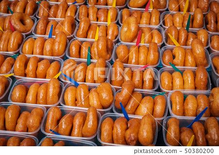 glazed donuts, sweet pastry in boxes for sale - 50380200