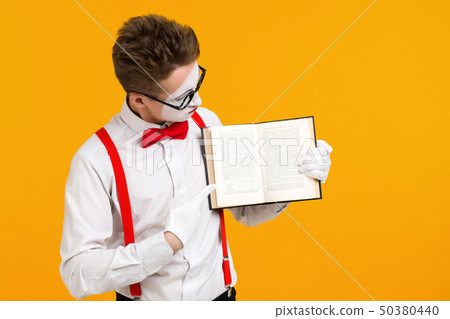 portrait of mime man artist with book 50380440