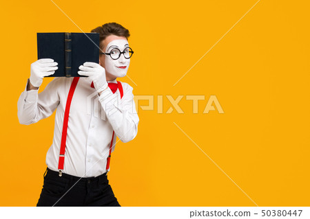 portrait of mime man artist with book 50380447