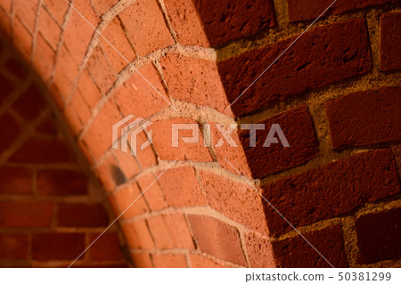 Old red brick wall with an arc background Old red brick wall with an arc background 50381299