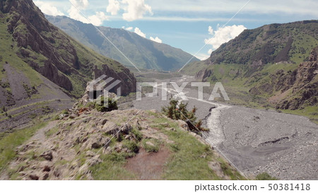 Aerial video of Dariali Gorge near Russia Georgian borders. Road goes through Caucasian mountains Aerial video of Dariali Gorge near Russia Georgian borders. Road goes through Caucasian mountains 50381418