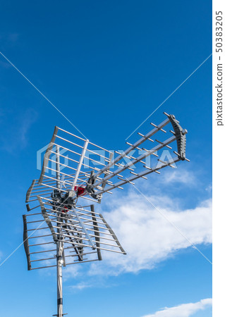 Tv antenna against blue sky 50383205