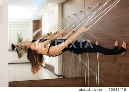 woman hanging on clothesline parallel to the woman hanging on clothesline parallel to the 50383436