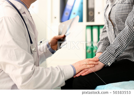 Clinic Doctor with X-ray Image Hold Patient Hand 50383553