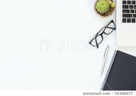 White office desk with supplies. 50386857