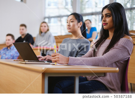 Multinational group of students in an auditorium 50387188