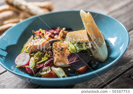 Fresh vegetable salad with roasted salmon olive Fresh vegetable salad with roasted salmon olive 50387753