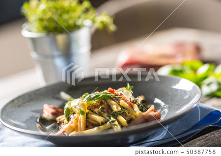 Pasta casarecce with bacon pancetta parmesan 50387758