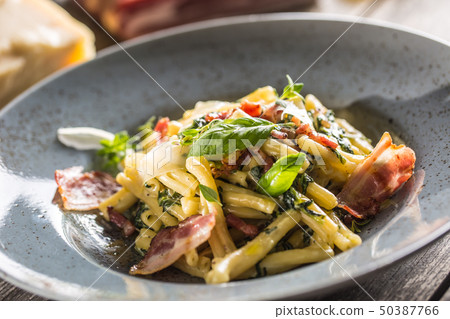 Pasta casarecce with bacon pancetta parmesan 50387766
