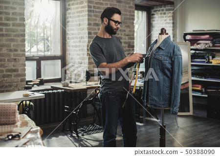 Fashion designer working in his studio 50388090