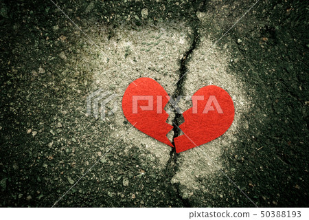 Broken red heart on cracked asphalt. divorce concept. Broken red heart on cracked asphalt. divorce concept. 50388193