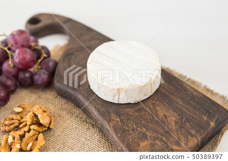 Blue cheese or brie with grapes and nuts 50389397