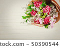 Fresh, lush bouquet of colorful flowers on white 50390544