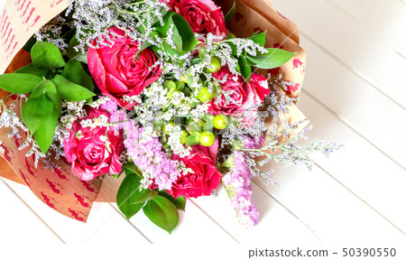 Fresh, lush bouquet of colorful flowers on white Fresh, lush bouquet of colorful flowers on white 50390550