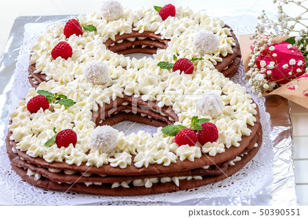 Big number cake shape of 8 decorated white Big number cake shape of 8 decorated white 50390551